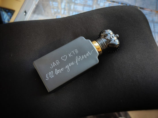 Luxury fragrance bottle custom engraved with the message "JAB heart KTB, I'll love you forever"